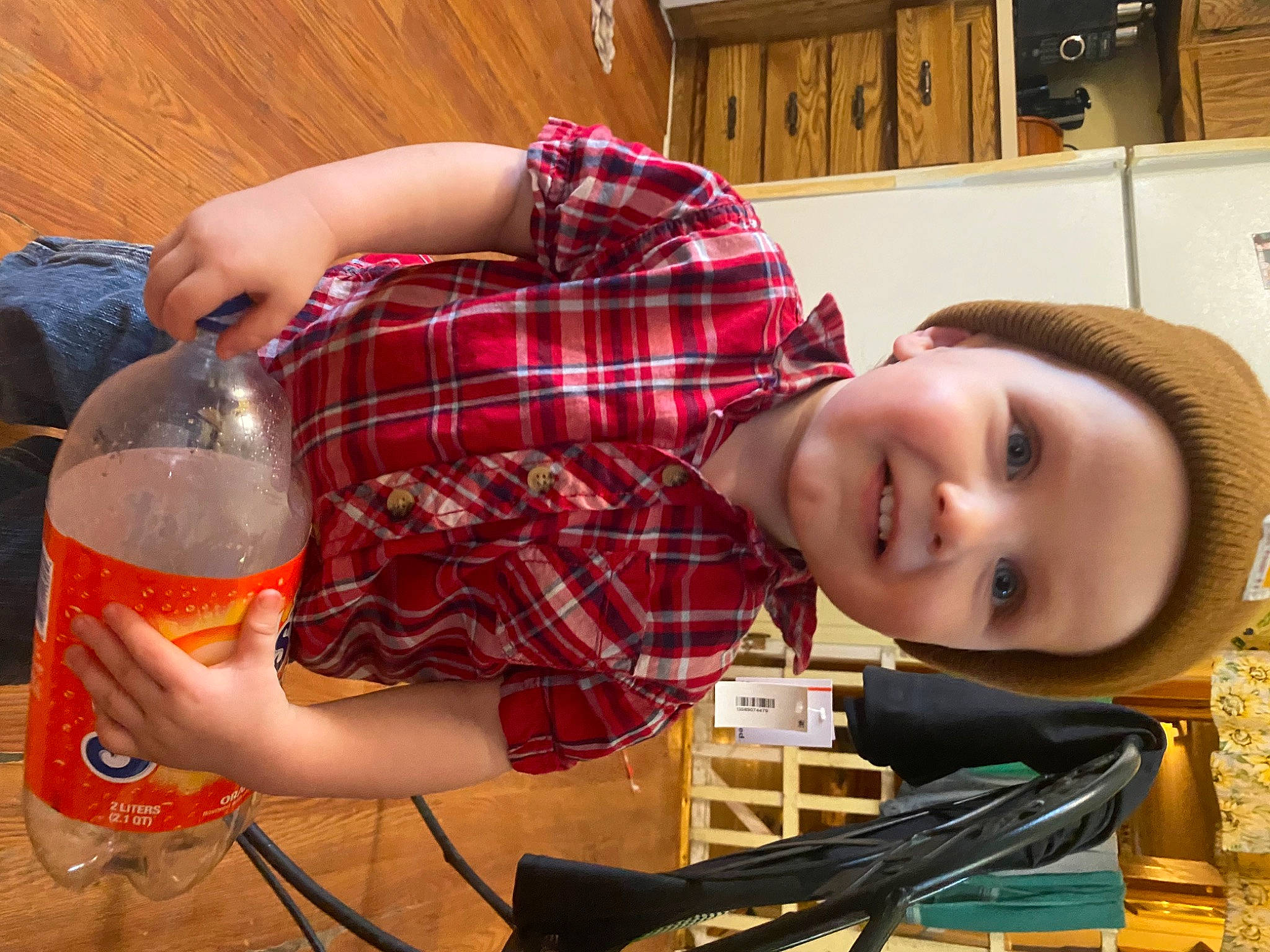 Brayden joined the competition — help win amazing prizes! barware, bottle, drink, drinkware, fun, glass, glass_bottle, happy, headwear, joy, pattern, person, personal_protective_equipment, plaid, room, sitting, smile, stemware, tableware, tartan