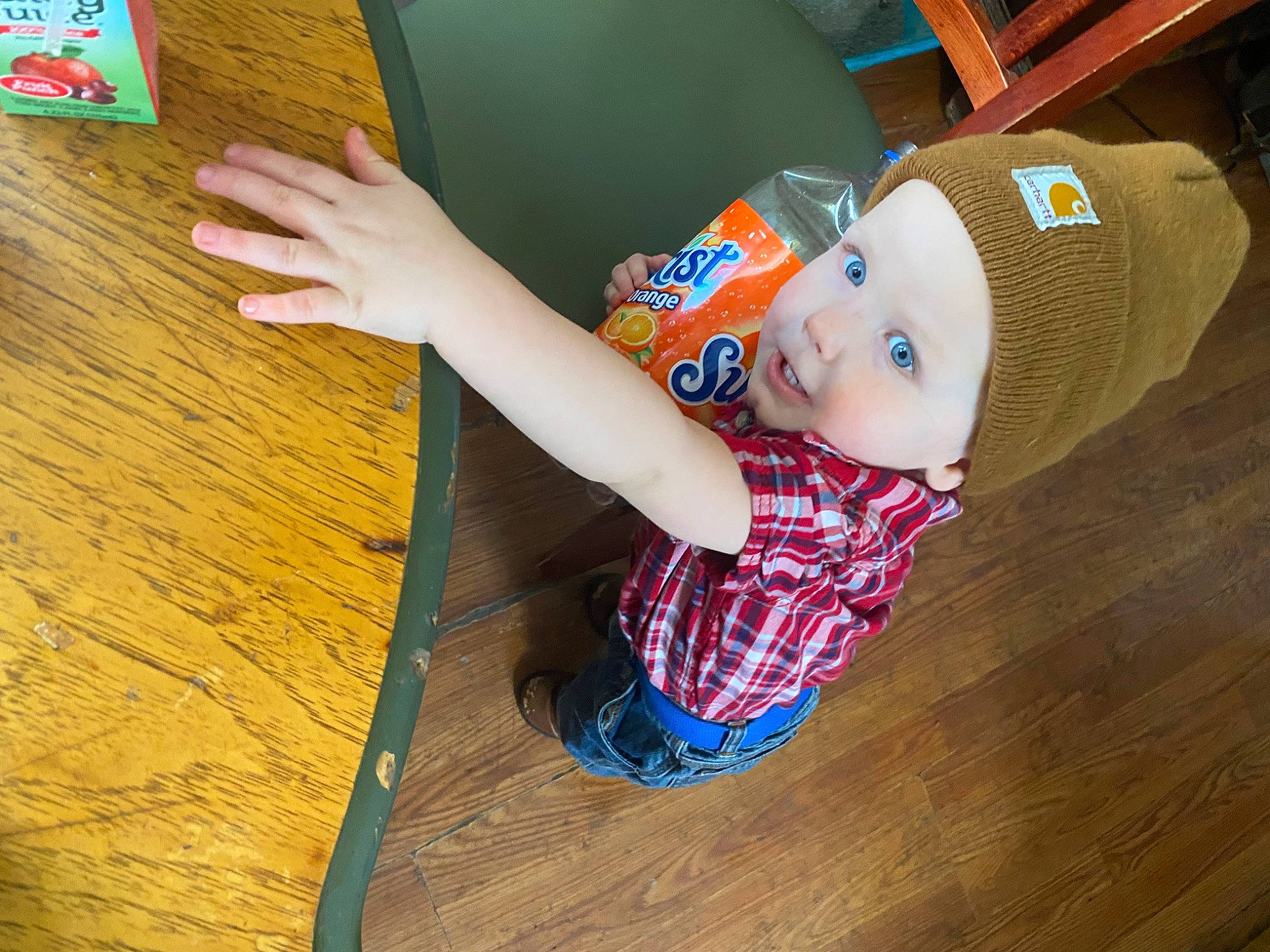 Brayden joined the competition — help win amazing prizes! baby, baby_toddler_clothing, baby_toys, cap, child, floor, flooring, foot, fun, hardwood, hat, headwear, leisure, pattern, person, smile, sock, toddler, varnish, wood