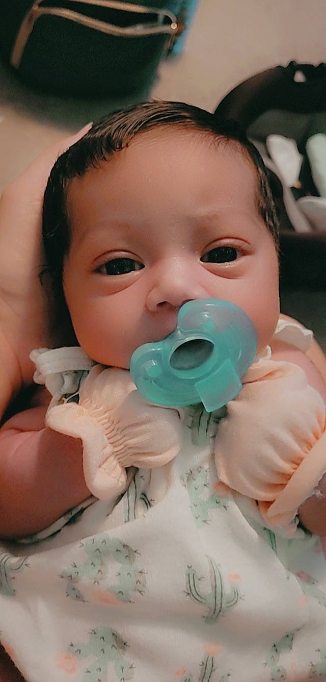 Reign joined the competition — help win amazing prizes! baby, baby_toddler_clothing, cheek, child, close_up, drinkware, eyebrow, eyelash, finger, fun, gesture, happy, iris, lip, mouth, nose, person, skin, tableware, thumb