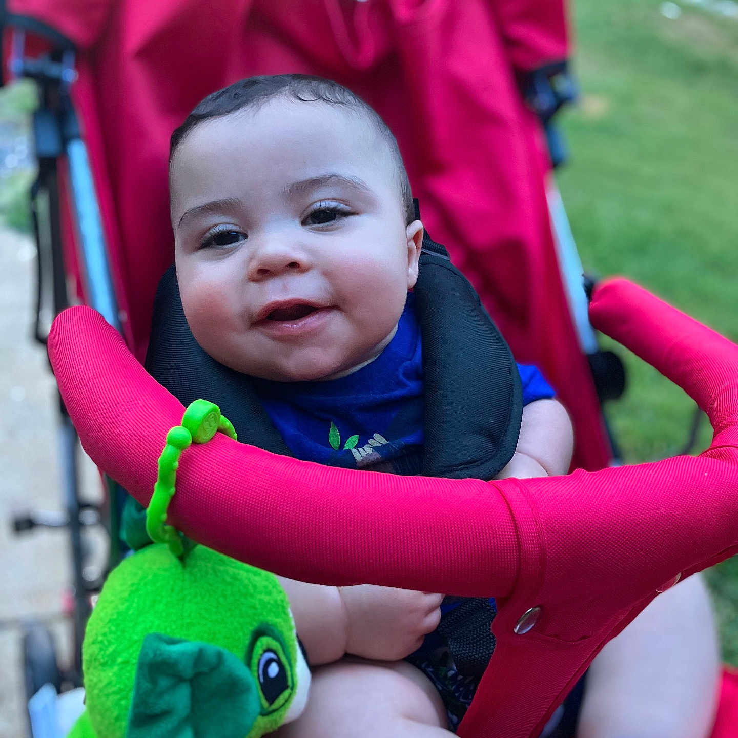 Isaiaah joined the competition — help win amazing prizes! architecture, baby, building, clothing, coat, face, grass, happy, head, jacket, nature, outdoors, park, person, photography, plant, portrait, smile, stroller, toy