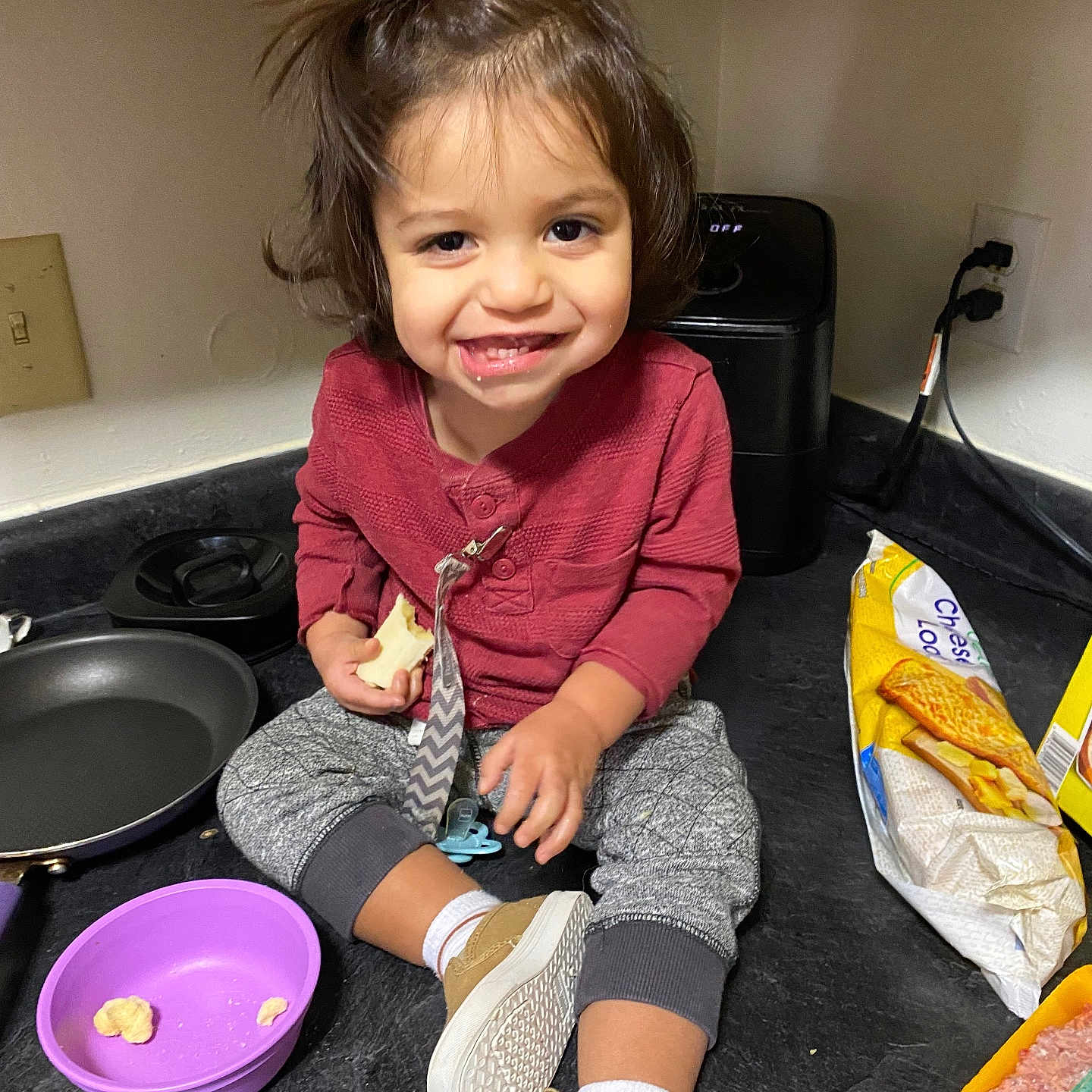 Julius is registered to the contest to win money with this photo: child, clothing, cookingpan, cookware, couch, cutlery, face, female, footwear, fork, furniture, girl, head, person, photography, portrait, shoe, shorts, sitting, spoon