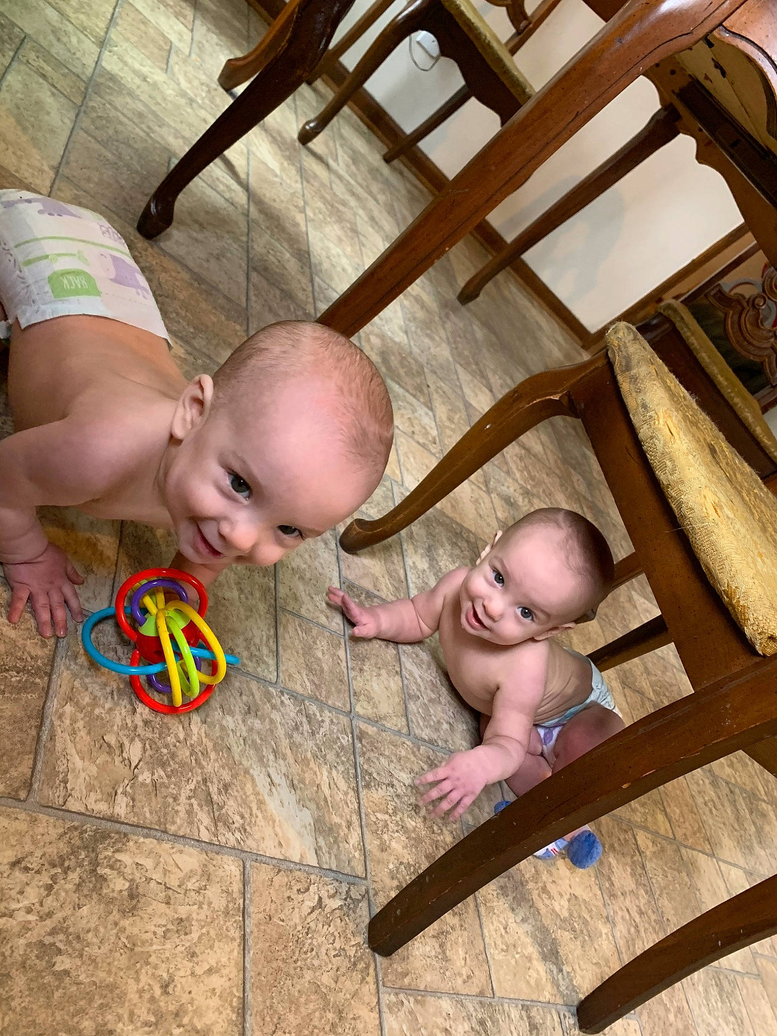 Ronald is registered to the contest to win money with this photo: baby, child, floor, flooring, fun, joy, leg, leisure, person, product, skin, toddler, vacation, wood