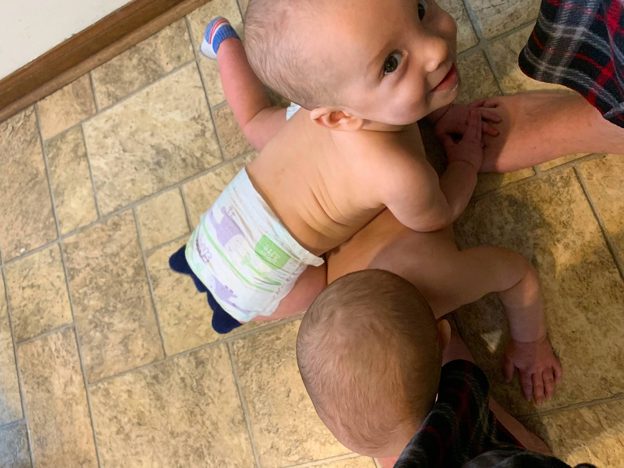 Ronald is registered to the contest to win money with this photo: baby, cheek, chest, child, eye, finger, floor, flooring, hand, head, leg, mouth, person, skin, thumb, toddler, trunk