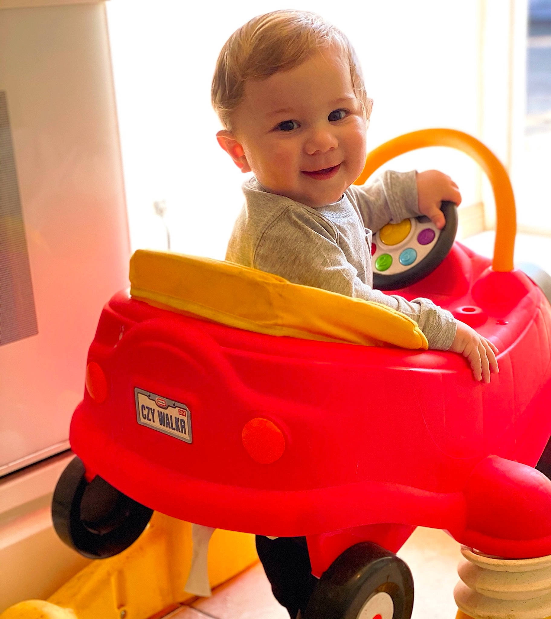Jomari joined the competition — help win amazing prizes! baby, baby_playing_with_toys, baby_safety, baby_toddler_clothing, cart, child, facial_expression, fun, happy, joy, person, photograph, recreation, riding_toy, sitting, smile, tire, toddler, toy, vehicle