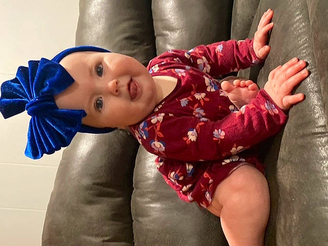 Anastasia is registered to the contest to win money with this photo: black_hair, child, elbow, eye, finger, fun, gesture, happy, head, headwear, human_body, human_leg, joint, knee, leg, neck, person, smile, textile, thigh