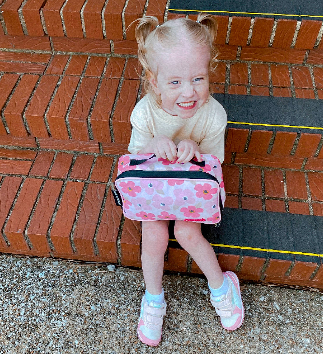 Annabella joined the competition — help win amazing prizes! baby_toddler_clothing, blond, child, dress, footwear, fun, grass, happy, human_leg, joy, leisure, magenta, pattern, people_in_nature, person, pink, shoe, sitting, sleeve, smile