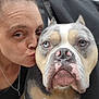 Enzo joined the competition — help win amazing prizes! person, dog, close_up, blue_eyes, kiss, affection, pet, portrait, face, outdoor, animal, love, companion, expression, furry, friendship, bond, nose_ring, casual, human