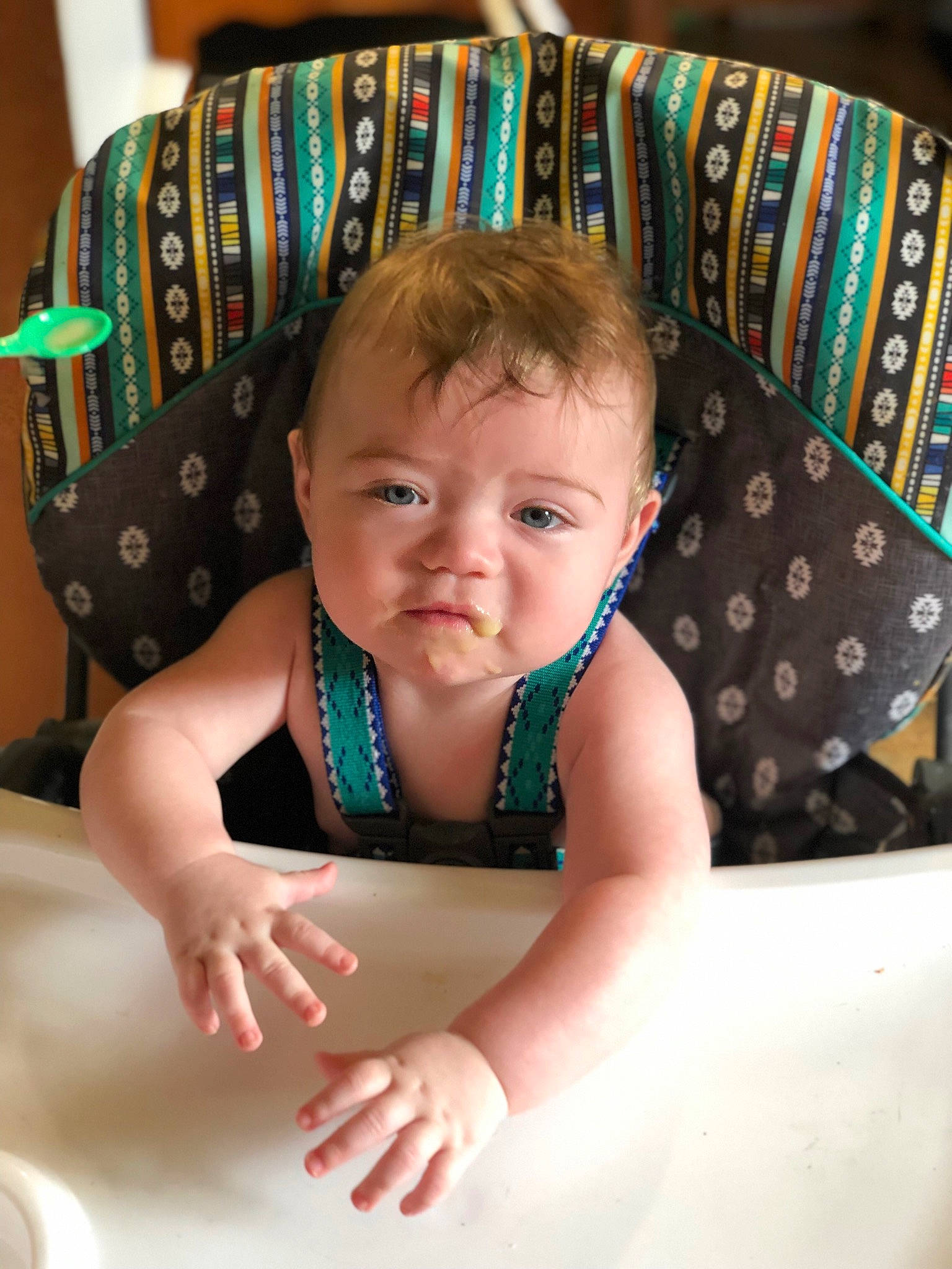 Konner is registered to the contest to win money with this photo: arm, baby, baby_products, baby_toddler_clothing, chair, cheek, child, couch, eye, face, facial_expression, hairstyle, happy, head, pattern, person, sitting, smile, stomach, table