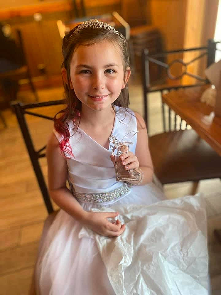 Rosalynn is registered to the contest to win money with this photo: bridal_accessory, bridal_party_dress, bride, ceremony, child, child_model, clothing, dress, gown, hair_accessory, headpiece, joy, person, satin, smile, white