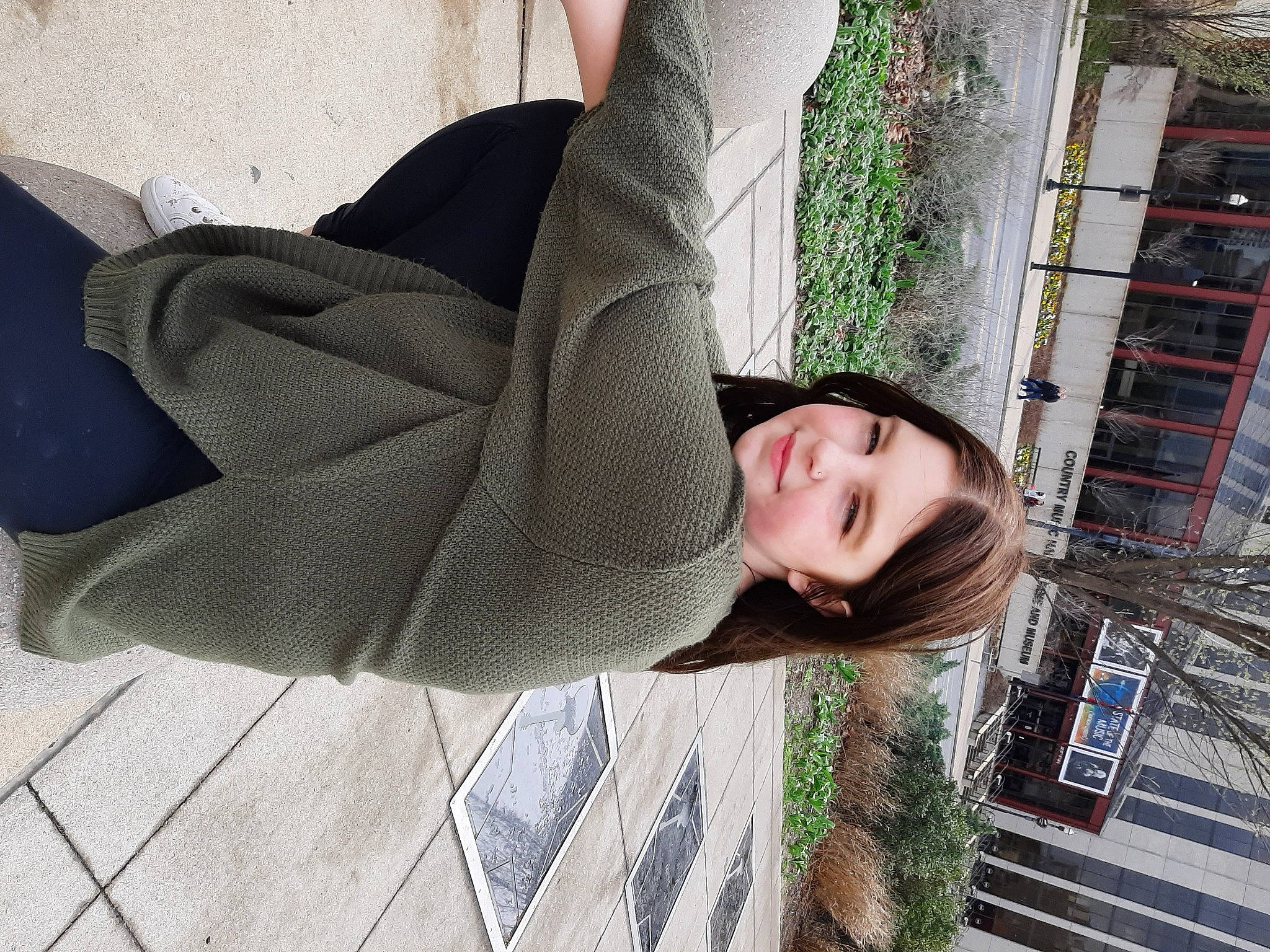 September is registered to the contest to win money with this photo: comfort, dress, fashion_accessory, grass, human_leg, joy, knee, linens, pattern, person, plant, shoulder, sitting, sleeve, street_fashion, t_shirt, thigh, tree, waist, wood