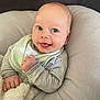 Thomas is registered to the contest to win money with this photo: baby, smile, face, infant, blanket, cushion, pajamas, bib, hand, cozy, cute, child, portrait, indoors, soft, comfort, happy, expression, skin, head