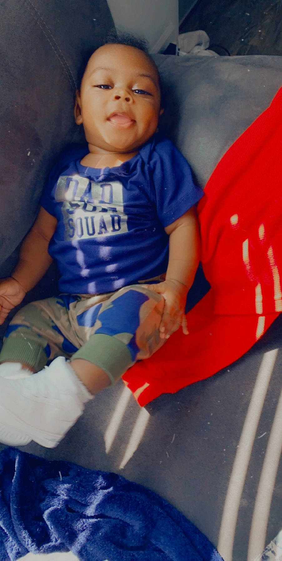 Kylan is registered to the contest to win money with this photo: baby, baby_toddler_clothing, blue, cheek, child, electric_blue, iris, knee, lap, overall, person, sock, toddler