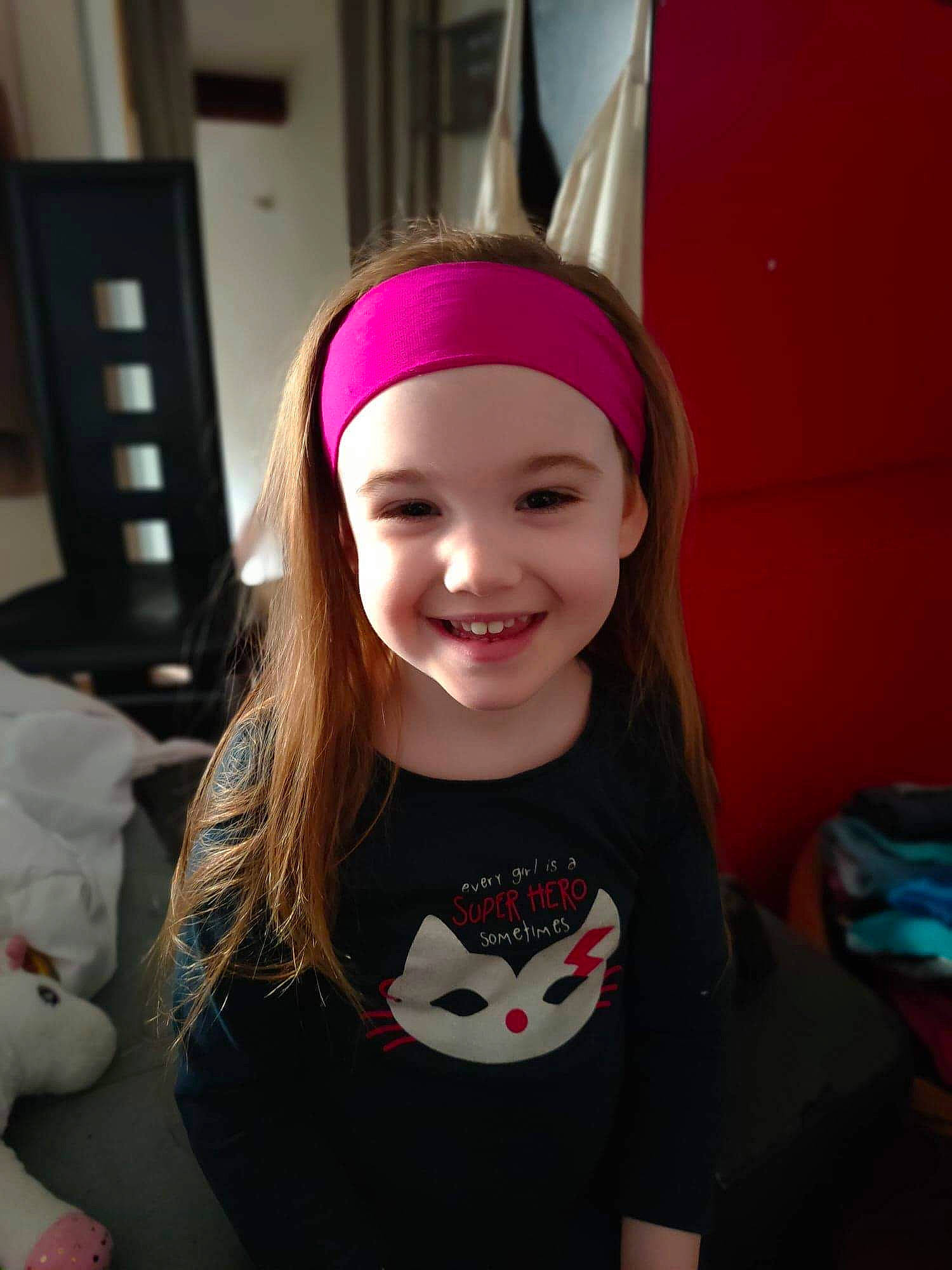 Tatiana participe au concours pour gagner de l'argent avec cette photo : beanie, cap, cheek, child, clothing, ear, face, fashion_accessory, hair_accessory, happy, head, headgear, headwear, joy, lip, long_hair, organ, person, pink, skin