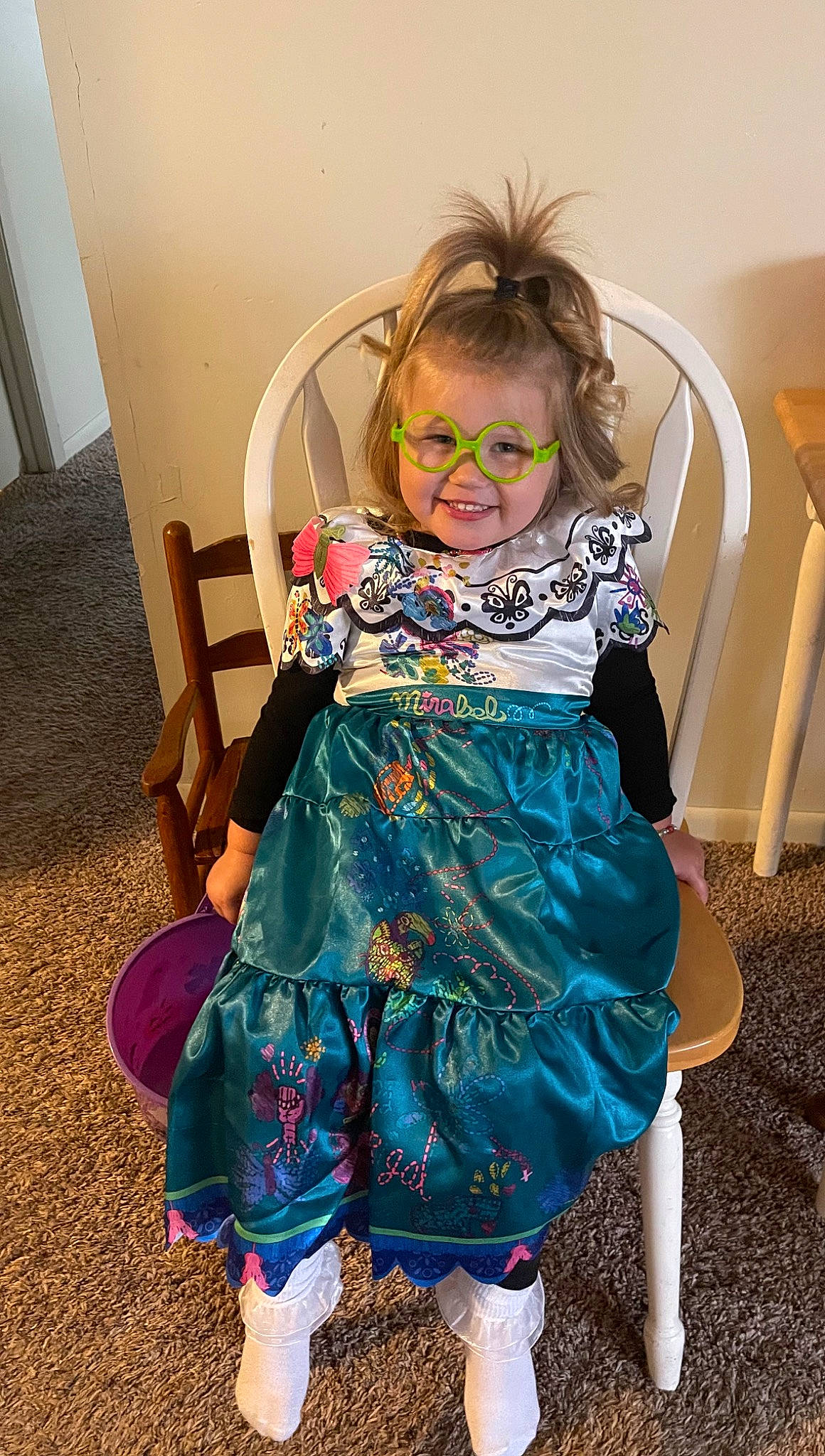 Malia is registered to the contest to win money with this photo: baby_toddler_clothing, blond, chair, child, costume, costume_design, day_dress, dress, fashion_accessory, fashion_design, flooring, formal_wear, fun, happy, joy, pattern, person, personal_protective_equipment, room, sitting