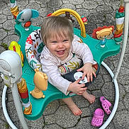 Briella Skye joined the competition — help win amazing prizes! toddler, baby, smiling, child, jumper, toy, playful, outdoor, footwear, pink_crocs, happy, barefoot, colorful, animal_toys, pavement, plastic, seat, clothing, person, cute