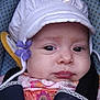 baby, child, hat, flower, car_seat, clothing, face, headwear, infant, seatbelt, patterned, pink, purple, white, portrait, closeup, person, cute, young, soft_lighting
