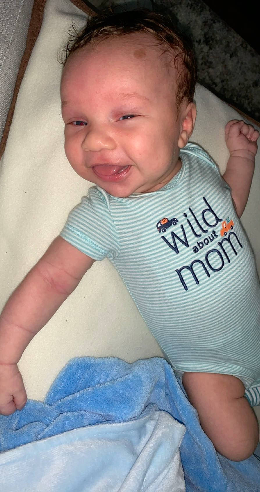 Augustine is registered to the contest to win money with this photo: arm, baby, baby_products, baby_toddler_clothing, cheek, child, person, product, sitting, skin, sleeve, smile, t_shirt, toddler