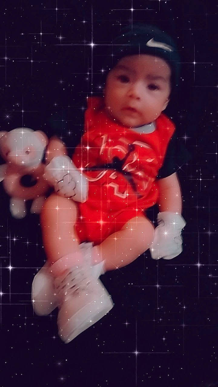 Xitlali joined the competition — help win amazing prizes! astronomical_object, carmine, cheek, child, doll, event, figurine, fun, gesture, happy, headwear, holiday, ornament, pattern, person, pink, plastic, space, thumb, toddler