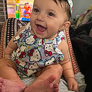 Mary joined the competition — help win amazing prizes! baby, smiling, child, infant, headband, clothing, hello_kitty, sitting, feet, toes, indoors, television, cartoon, colorful, happy, person, cute, expression, closeup, playful