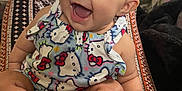 Mary joined the competition — help win amazing prizes! baby, smiling, child, infant, headband, clothing, hello_kitty, sitting, feet, toes, indoors, television, cartoon, colorful, happy, person, cute, expression, closeup, playful