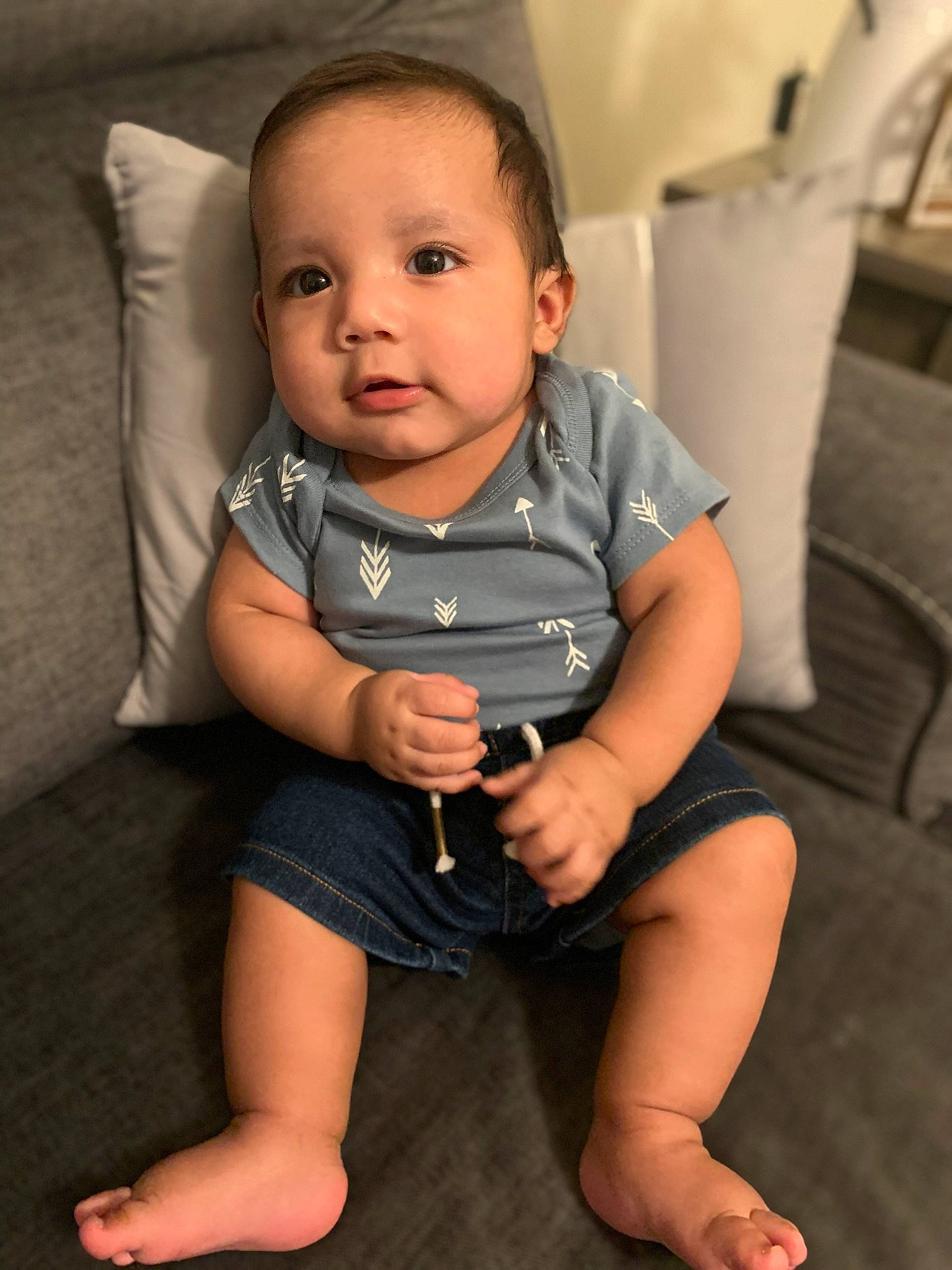 Julian is registered to the contest to win money with this photo: baby, baby_toddler_clothing, cheek, child, comfort, elbow, eye, eyelash, face, finger, flash_photography, flooring, head, human_leg, iris, knee, neck, person, skin, thigh