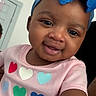 baby, bow, child, closeup, cute, eyes, face, happy, headband, hearts, indoor, infant, mouth, nose, person, pink_shirt, portrait, skin, smiling, young_child