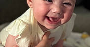 Charlotte joined the competition — help win amazing prizes! baby, blanket, child, clothing, cute, expression, face, hand, happy, holding, indoors, infant, person, portrait, sitting, skin, smiling, soft, warm, young