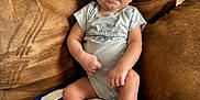 Creed joined the competition — help win amazing prizes! baby, infant, smiling, couch, blanket, indoor, child, person, comfortable, relaxed, clothing, sitting, happy, skin, foot, hand, head, blue, white, brown