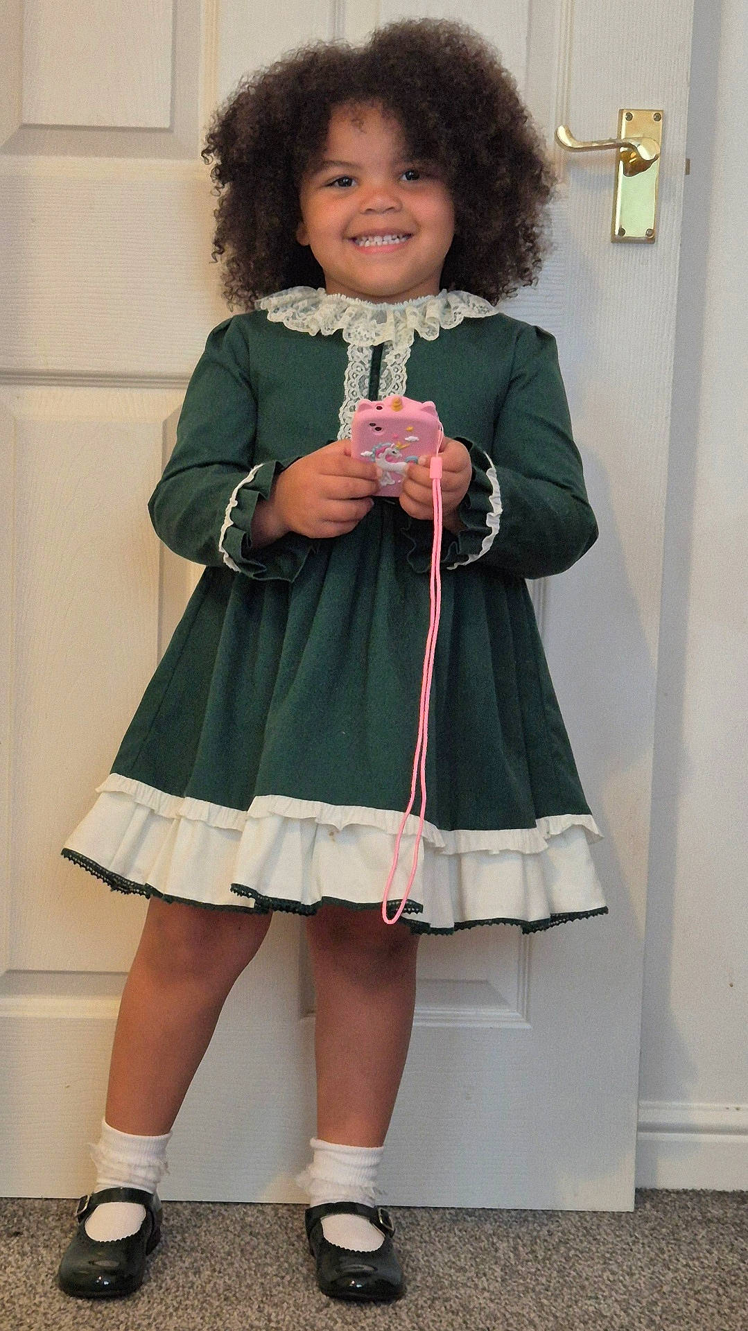 Aubrey is registered to the contest to win money with this photo: child, clothing, coat, costume, dress, face, female, footwear, formalwear, girl, head, jacket, longsleeve, person, photography, portrait, sandal, shoe, skirt, sleeve