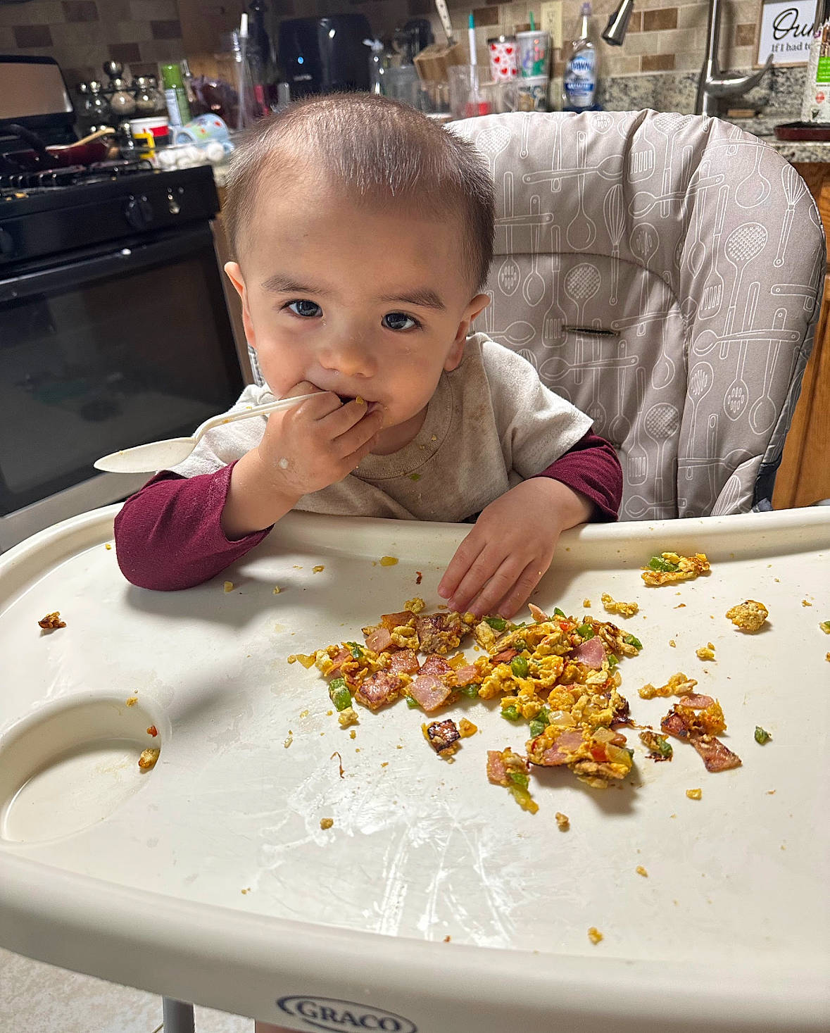 Alvaro is registered to the contest to win money with this photo: baby, baby_toddler_clothing, chair, child, comfort_food, cooking, cuisine, dish, food, fun, home_appliance, ingredient, junk_food, kitchen_appliance, person, recipe, room, snack, sweetness, tableware