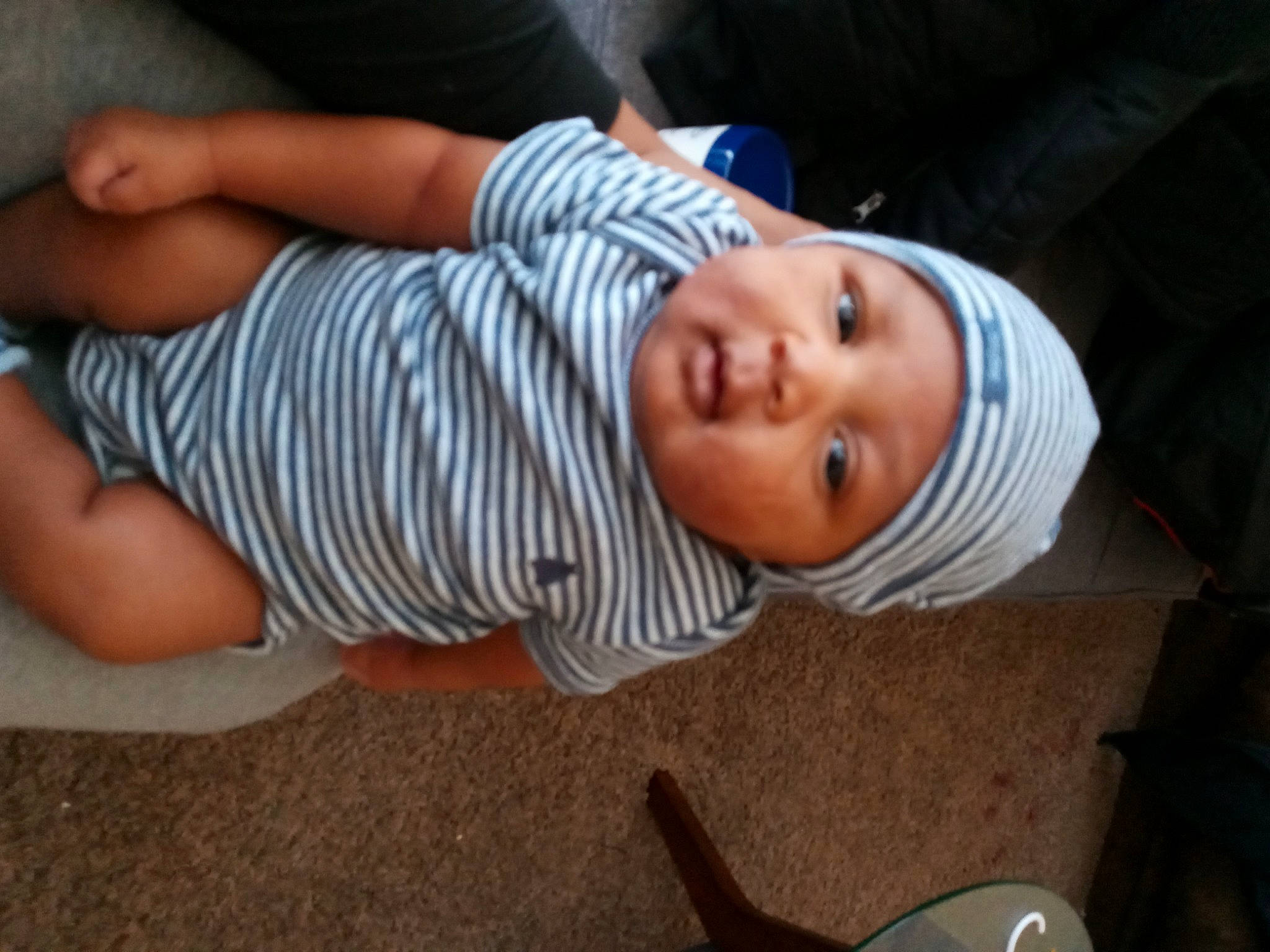 Jai joined the competition — help win amazing prizes! baby, baby_products, baby_toddler_clothing, cheek, child, comfort, elbow, fun, grass, hat, headwear, human_body, human_leg, mouth, nose, person, sitting, skin, sleeve, smile