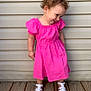 toddler, child, pink_dress, white_sandals, curly_hair, smiling, outdoor, wooden_floor, siding, happy, portrait, cute, standing, young_child, playful, fashion, feet, person, summer, innocence