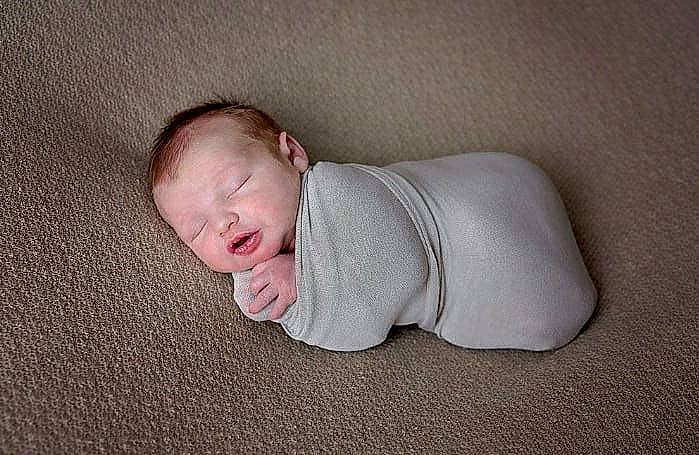 Denver joined the competition — help win amazing prizes! baby, baby_products, baby_sleeping, baby_toddler_clothing, cheek, child, comfort, eye, flooring, fur, grass, grey, linens, person, portrait_photography, sitting, sleeve, toddler, tummy_time, wood