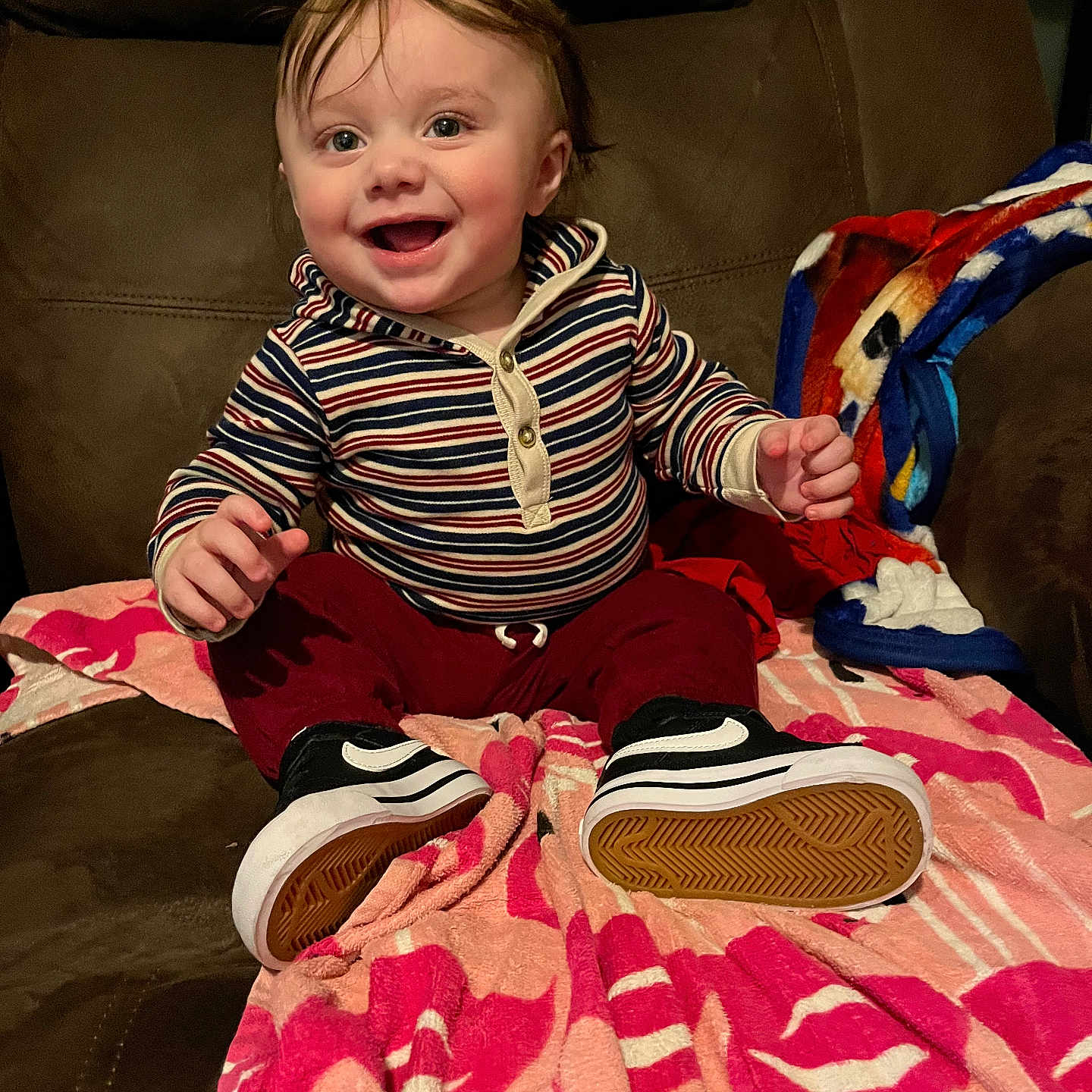 Braylin is registered to the contest to win money with this photo: baby, babylaughing, blanket, bodypart, clothing, couch, cushion, face, finger, footwear, furniture, hand, happy, head, homedecor, laughing, person, photography, portrait, quilt