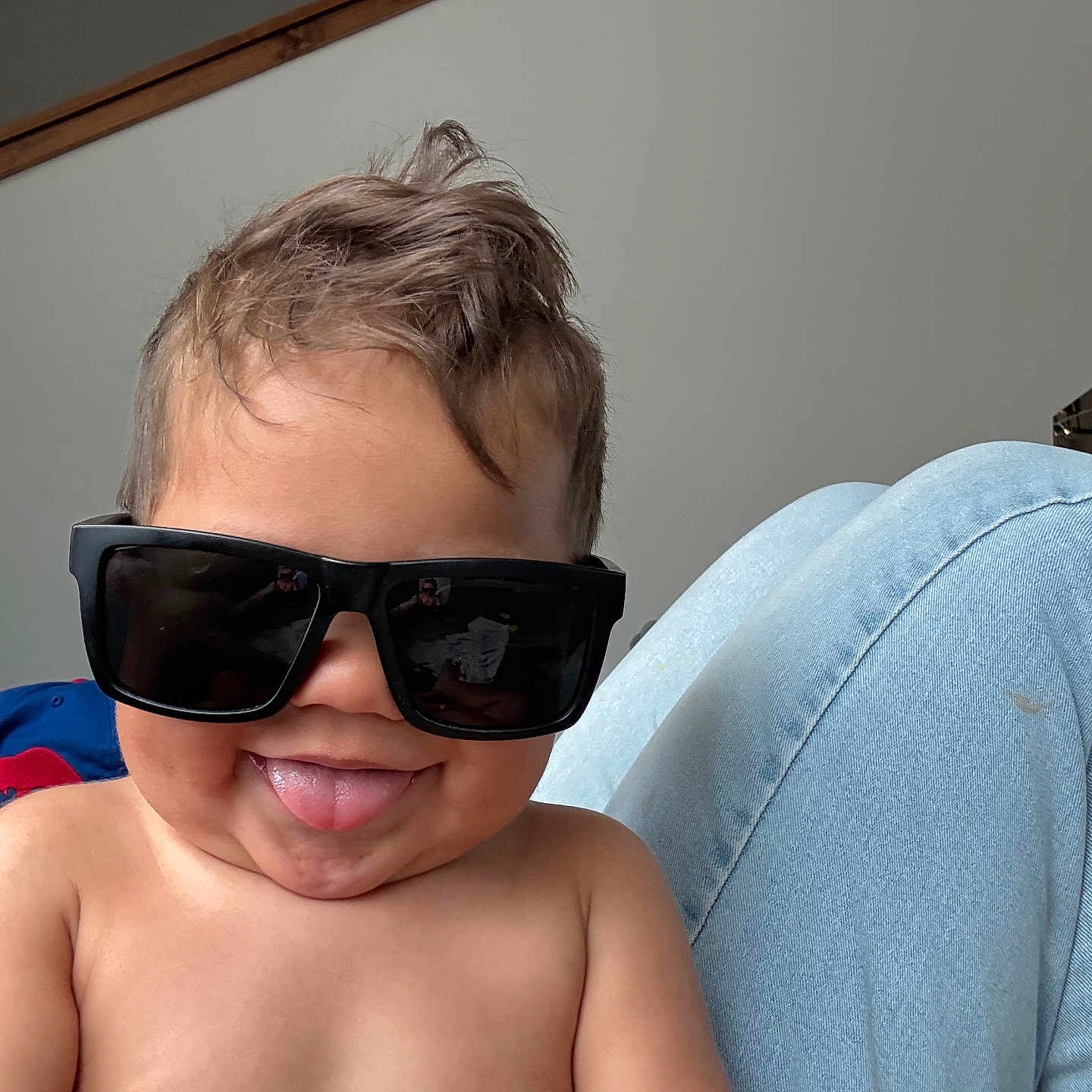 Duck is registered to the contest to win money with this photo: casual, child, cute, funny_expression, hair, happy, indoor, jeans, legs, light_background, person, playful, portrait, shirtless, skin, smile, sunglasses, toddler, tongue_out, young_child
