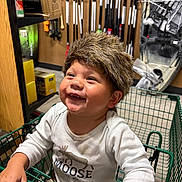 Duck joined the competition — help win amazing prizes! child, toddler, shopping_cart, furry_hat, smiling, indoor, store, tools, boxes, clothing, happy, baby, face, person, retail, shelf, cute, fun, young_child, casual