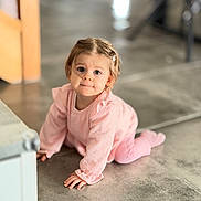 Elya a rejoint le concours — aidez-le/la à gagner de superbes lots ! baby, child, concrete_floor, crawling, curious, cute, expression, face, floor, hair_clip, hands, home, indoors, person, pink_clothing, portrait, small_hands, soft_lighting, toddler, young_child