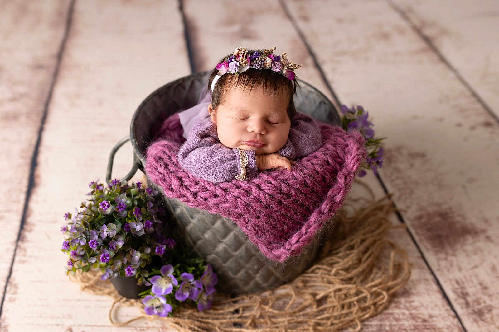 Charline a rejoint le concours — aidez-le/la à gagner de superbes lots ! newborn, baby, sleeping, flower_crown, purple_blanket, metal_bucket, flowers, wooden_floor, cozy, portrait, infant, cute, peaceful, resting, headband, knit_blanket, closeup, indoors, decor, soft_lighting