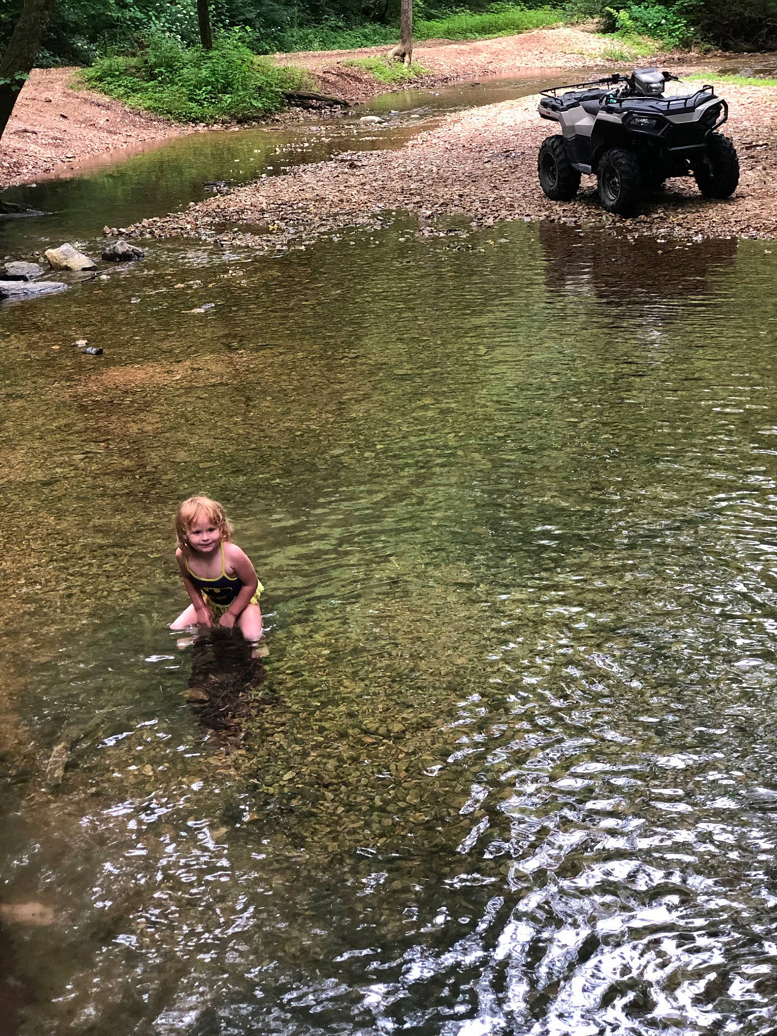 Arianna joined the competition — help win amazing prizes! automotive_tire, bank, body_of_water, grass, joy, lake, landscape, leisure, people_in_nature, person, plant, recreation, tire, toddler, tree, vehicle, vertebrate, water, water_resources, watercourse
