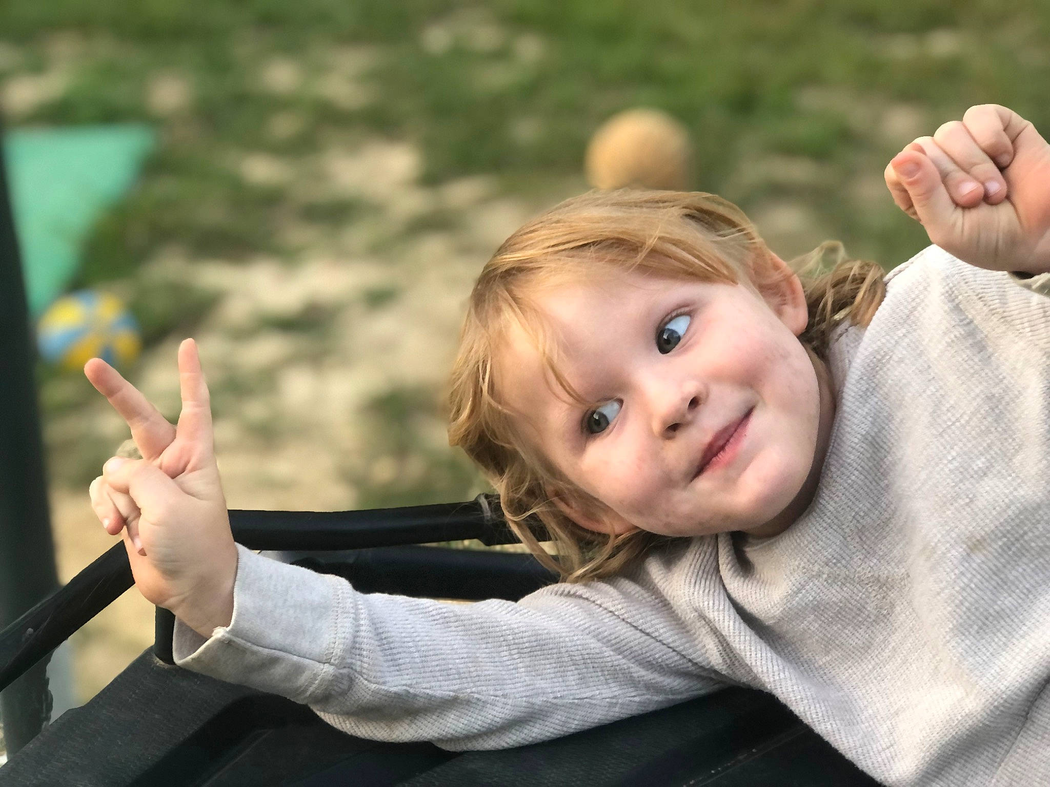 Arianna joined the competition — help win amazing prizes! arm, finger, flash_photography, fun, gesture, grass, hand, happy, human_body, joy, leisure, people_in_nature, person, plant, skin, smile, standing, thumb, toddler, tree