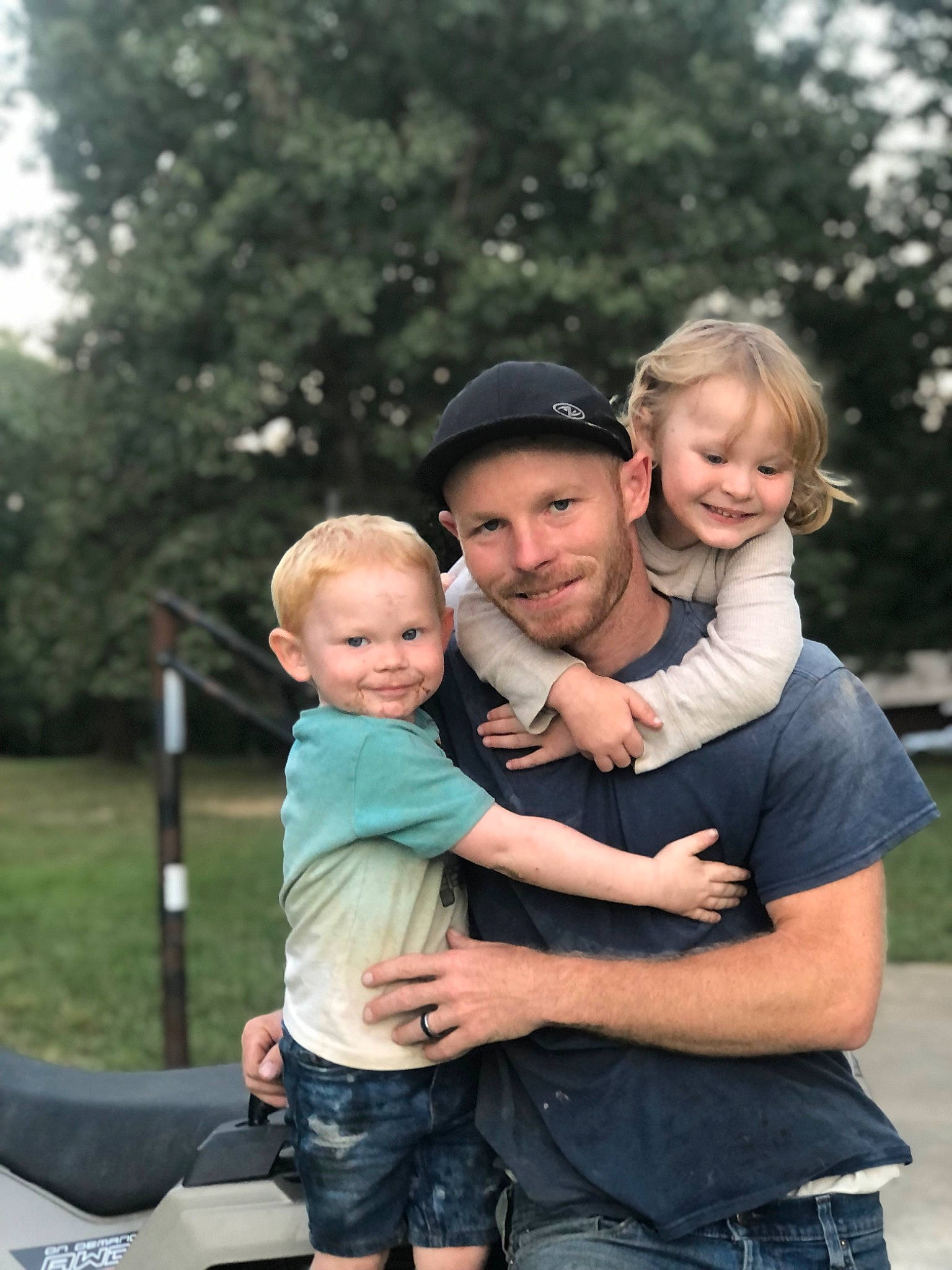 Arianna joined the competition — help win amazing prizes! baby, child, event, face, facial_expression, flash_photography, fun, gesture, grass, happy, headwear, joy, leisure, muscle, people_in_nature, person, plant, shorts, sitting, smile