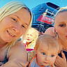 baby, child, woman, outdoor, car, sky, smile, family, portrait, blond_hair, casual, sunlight, tattoo, happy, people, closeup, toy, colorful, daytime, heart_icon