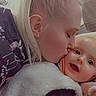 baby, woman, kiss, affection, blonde_hair, high_ponytail, indoor, cozy, vest, face, happy, close_up, person, expression, love, child, candid, text_overlay, heart_emoji, casual