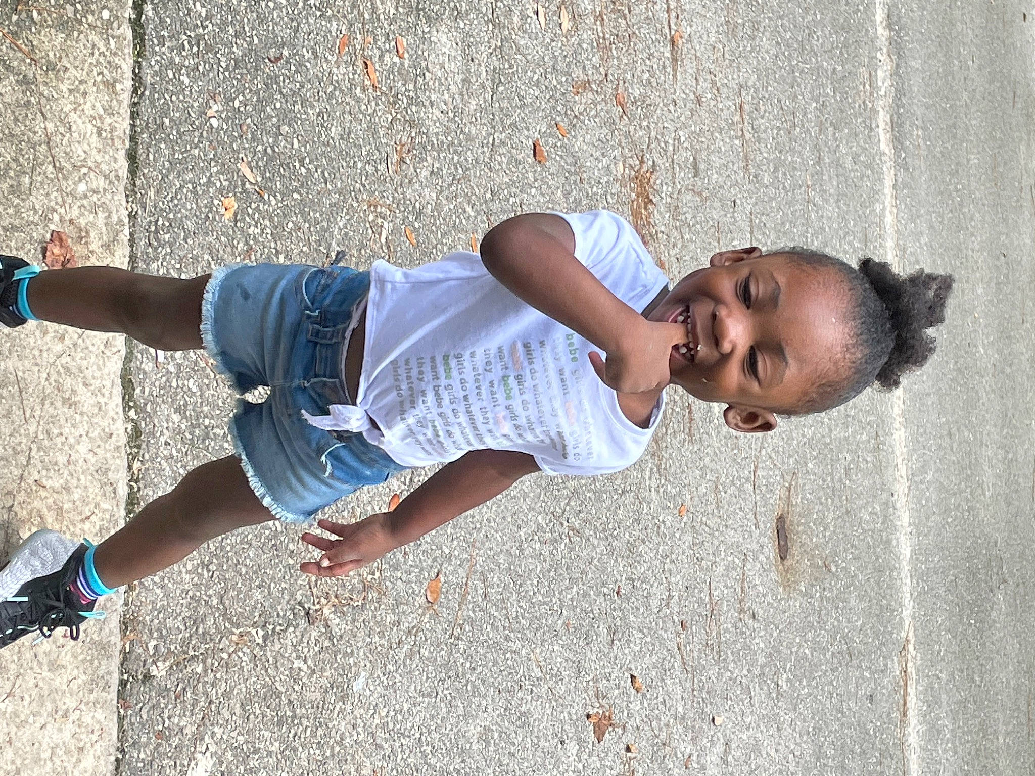 Anylah is registered to the contest to win money with this photo: asphalt, denim, elbow, electric_blue, eyewear, fun, happy, human_leg, joy, knee, leisure, person, road_surface, shorts, sleeve, street_fashion, sunglasses, t_shirt, thigh, toddler