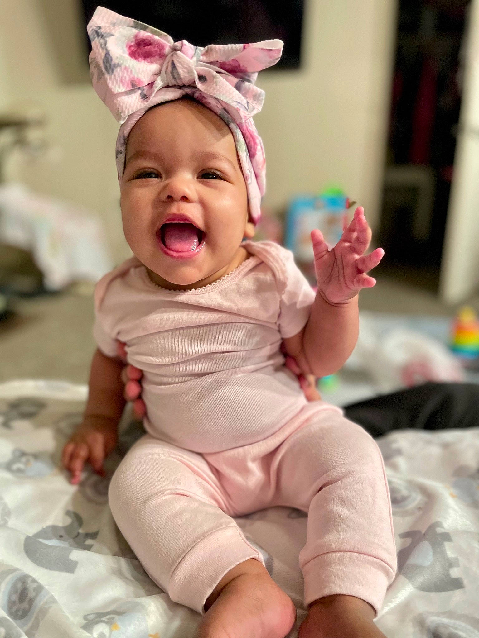Azlyn is registered to the contest to win money with this photo: baby, baby_toddler_clothing, cap, cheek, dress, eye, face, foot, happy, head, headgear, human_body, knee, party_hat, person, pink, skin, sleeve, smile, sock
