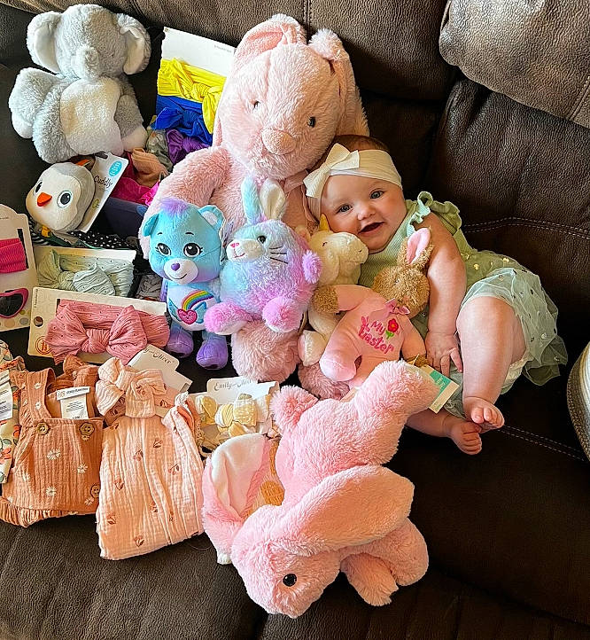Emberlynn joined the competition — help win amazing prizes! baby_products, baby_toddler_clothing, baby_toys, child, collectable, collection, comfort, event, font, happy, headwear, party_supply, peach, person, pink, plush, souvenir, stuffed_toy, sweetness, teddy_bear