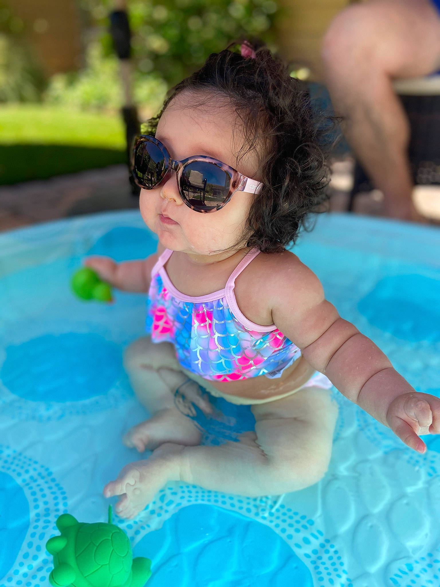 Liana is registered to the contest to win money with this photo: baby, child, cool, eyewear, fun, games, glasses, goggles, leisure, person, personal_protective_equipment, play, pool, recreation, smile, summer, sunglasses, swimming_pool, swimwear, toddler
