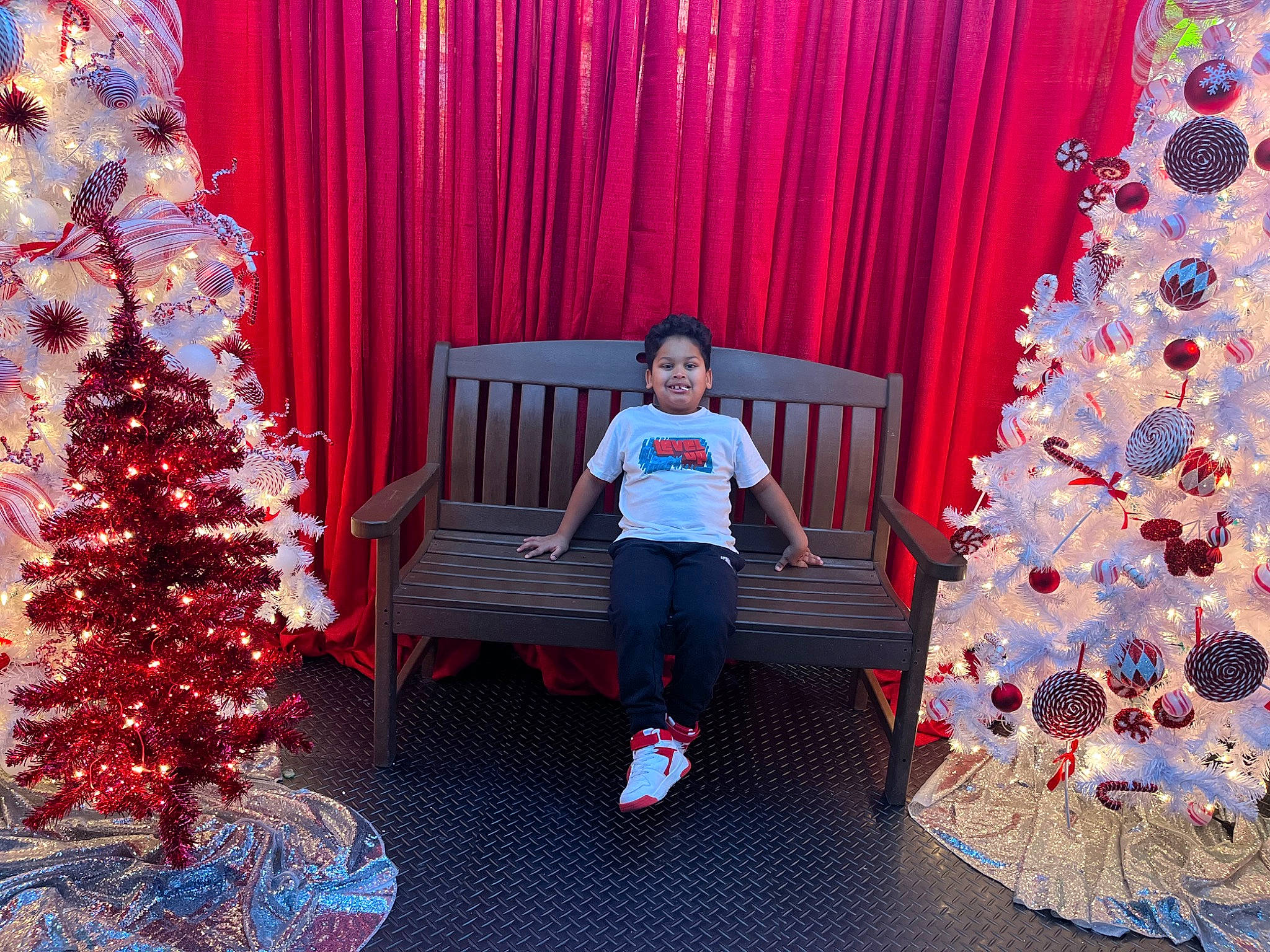 Wilderson joined the competition — help win amazing prizes! blue, christmas, christmas_decoration, christmas_ornament, christmas_tree, curtain, decoration, holiday, holiday_ornament, joy, light, lighting, ornament, person, pink, purple, red, standing, textile, tree