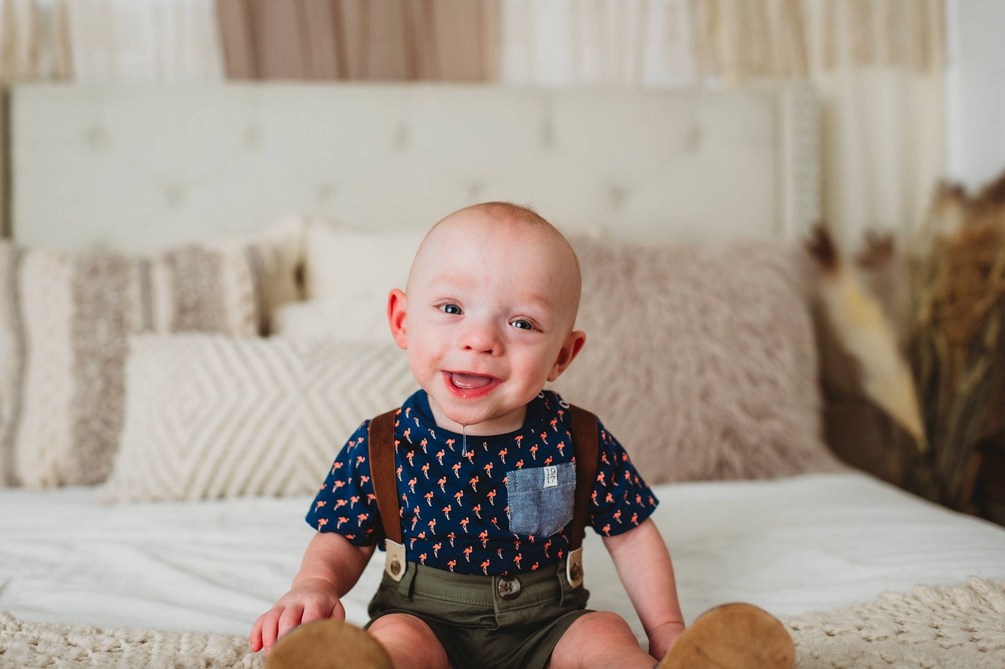 Callum is registered to the contest to win money with this photo: baby, baby_toddler_clothing, child, clothing, comfort, couch, eye, flash_photography, flooring, happy, joy, pattern, person, portrait_photography, shorts, sitting, skin, sleeve, smile, t_shirt