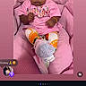 Delilah Dior Moore is registered to the contest to win money with this photo: baby, child, pink, yellow_bow, headband, sitting, cushion, chair, clothing, footwear, sneakers, portrait, indoor, cute, person, infant, looking, expression, colorful, fashion